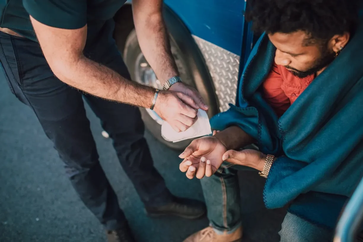 Injured person receiving first aid after a car accident, emphasizing urgency of filing within California statute of limitations